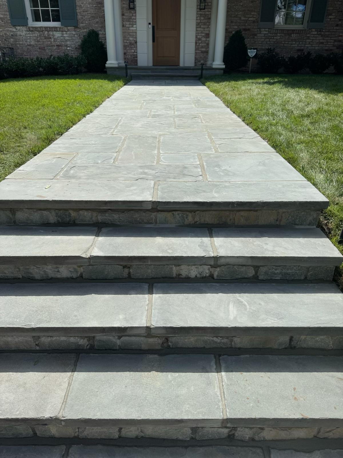 Finished flagstone entry steps leading to a home