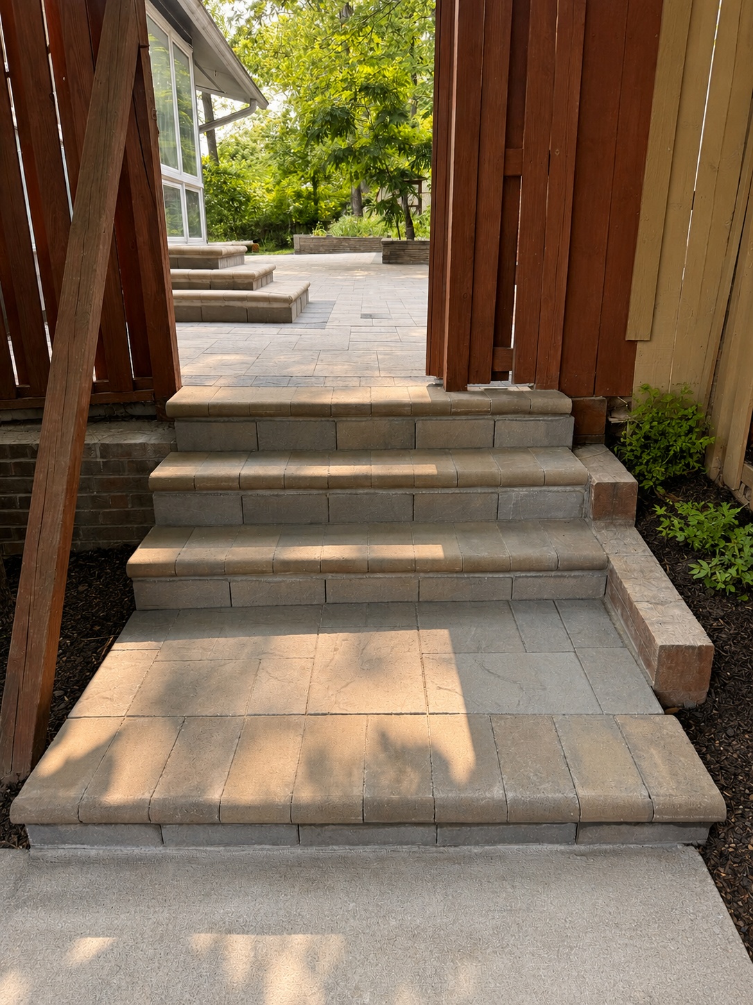 Paver patio entry with steps and outdoor hardscape