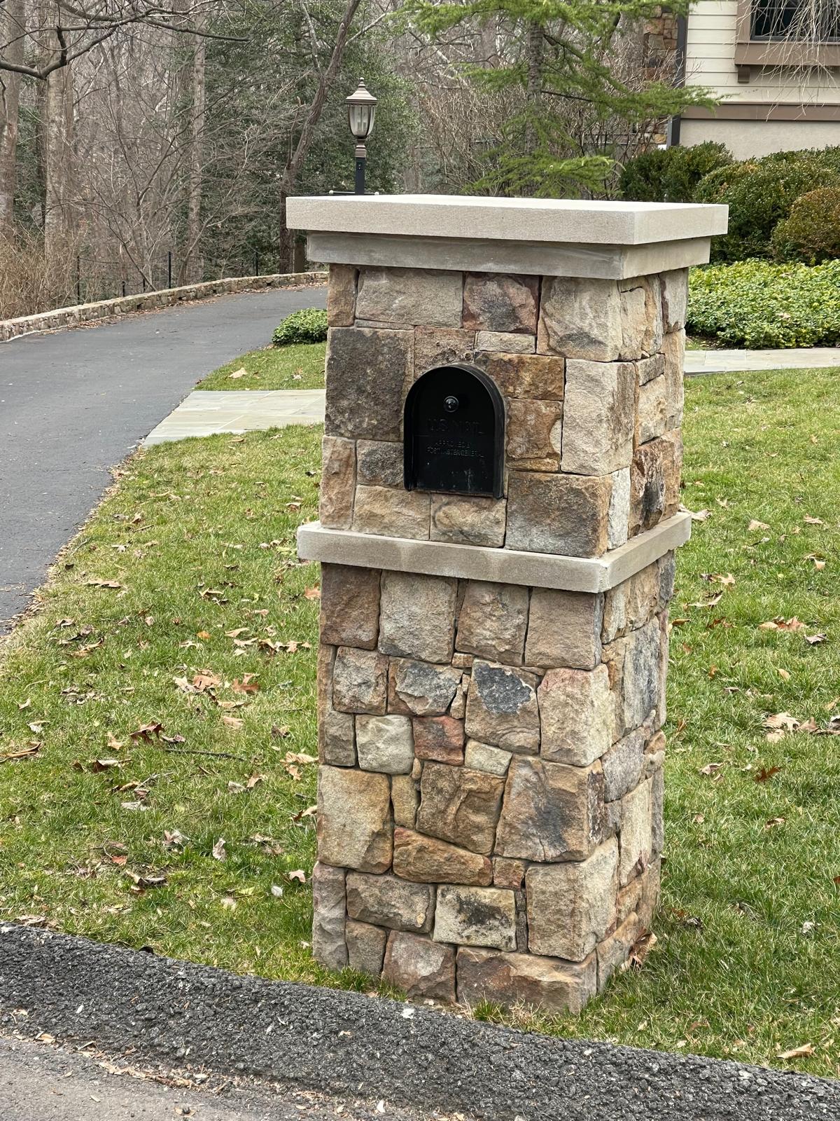 Custom stone mailbox built by Flores Landscaping