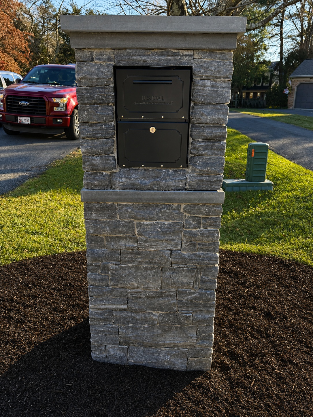 Custom stone mailbox built by Flores Landscaping