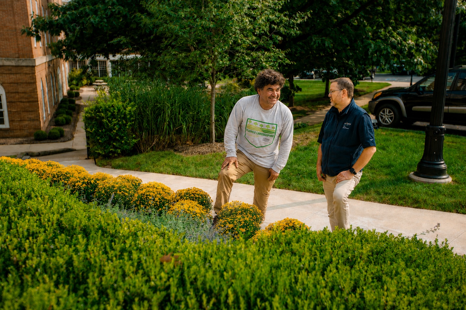 Flores Landscaping consultation with homeowner on property